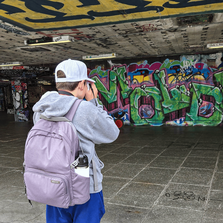 Tyler shooting graffiti in skate park