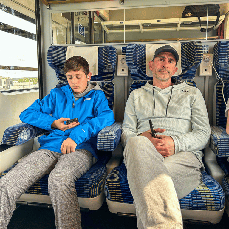 Eric and Tyler on the train looking tired