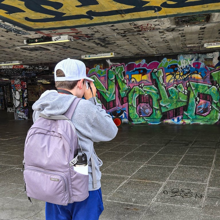 Tyler shooting graffiti in skate park