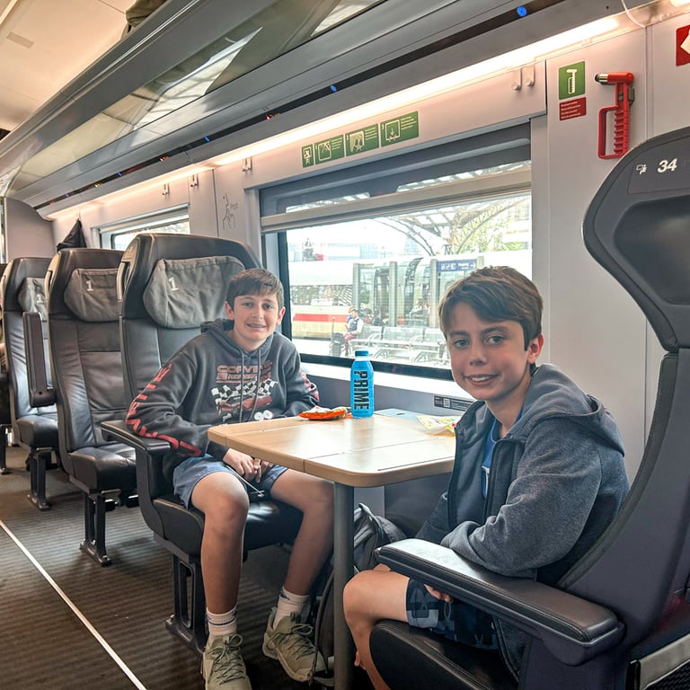 The boys waving in their seats