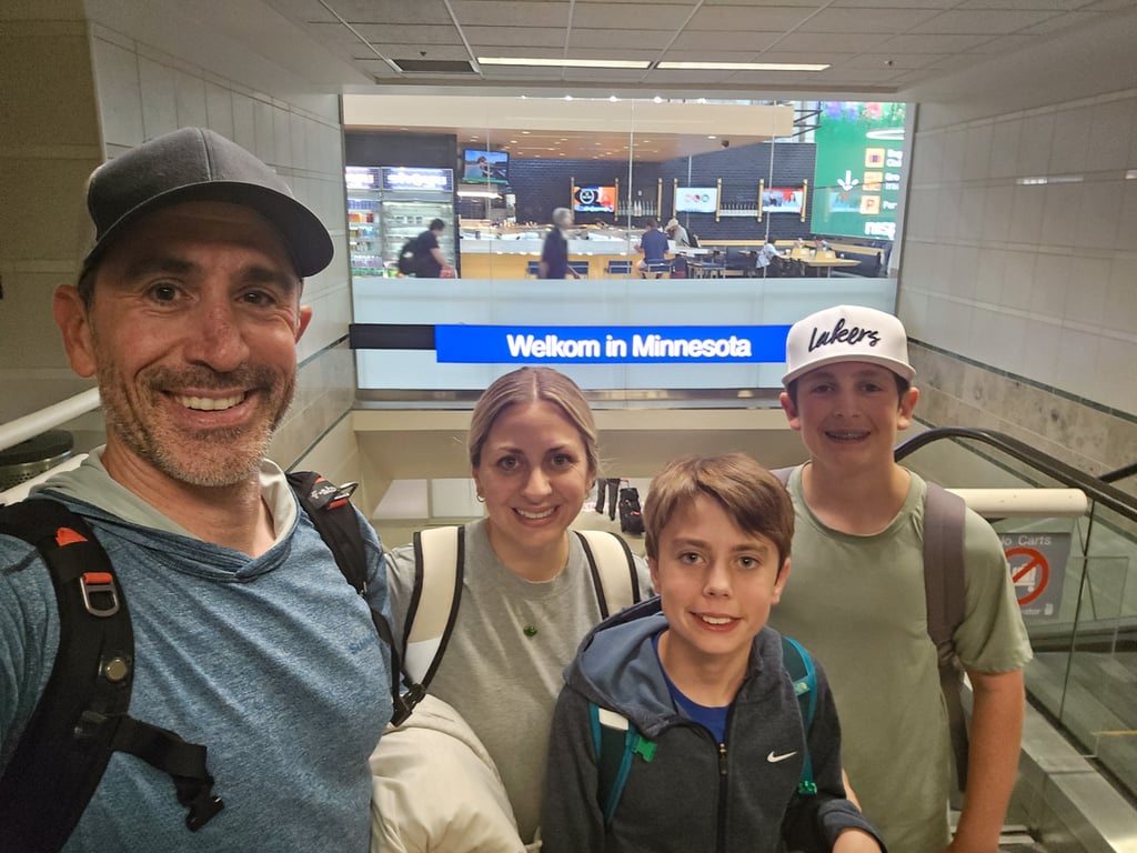 A selfie of the family in the airport (AFTER)