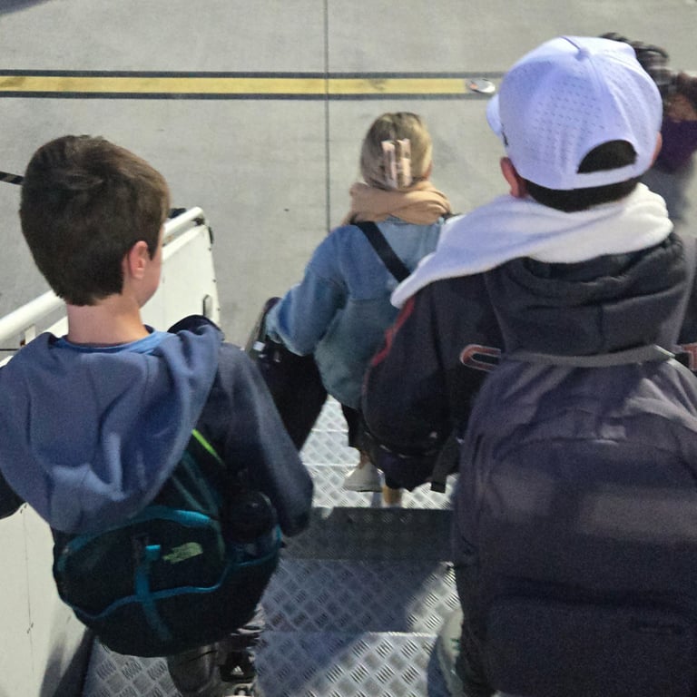 Exiting the plan on the tarmac...Lori's favorite