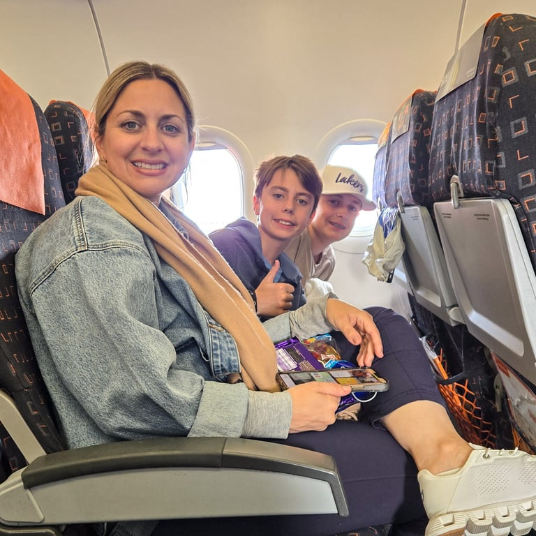 Family sitting on plane. Looking tired?