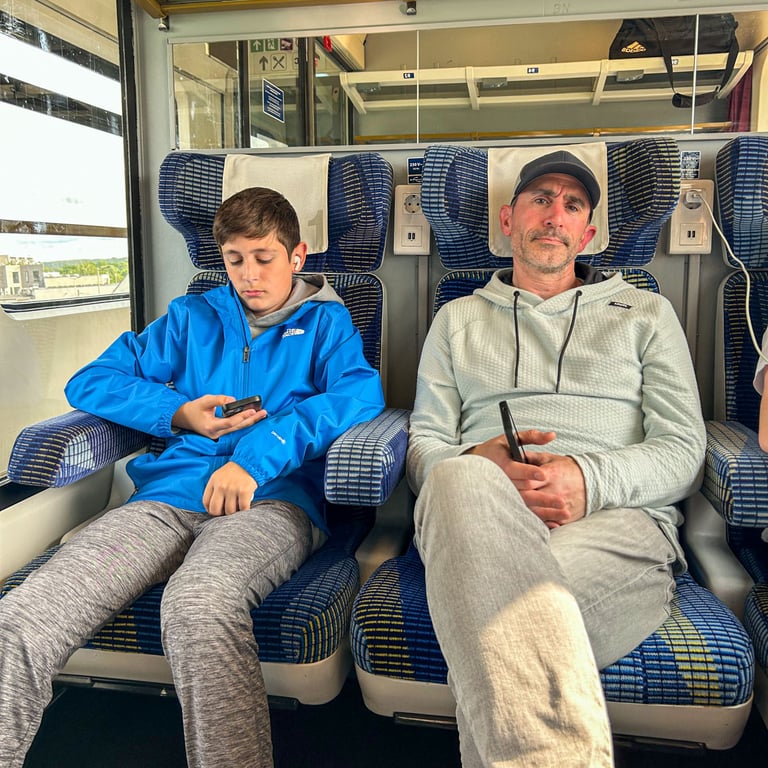 Eric and Tyler on the train looking tired