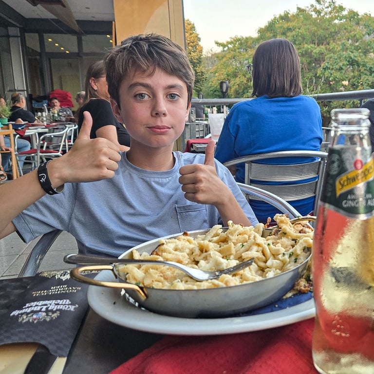 Max with two thumbs up on dinner